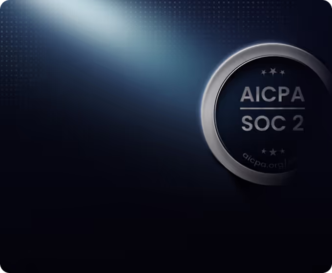 A metallic medallion with the text 'AICPA SOC 2' illuminated by a soft spotlight on a dark blue background.